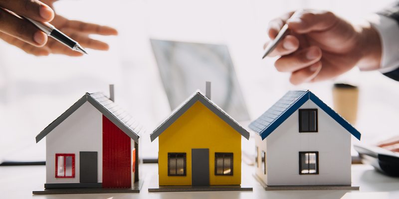 Real estate agent and customer signing contract to buy house, insurance or loan real estate.rent a house,get insurance or loan real estate or property.